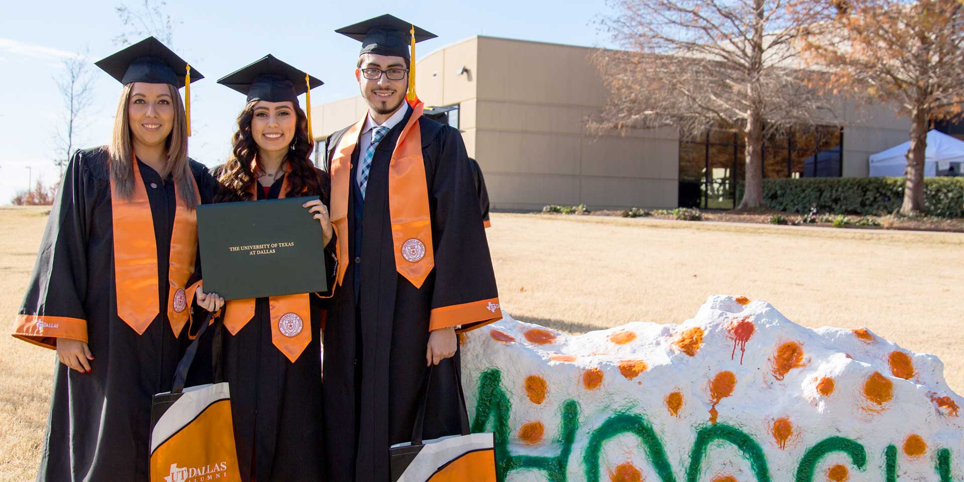 Bachelor's in supply chain management graduate Alfredo Beltran with two friends who graduated with bachelor's degrees at the Jindal School, UT Dallas