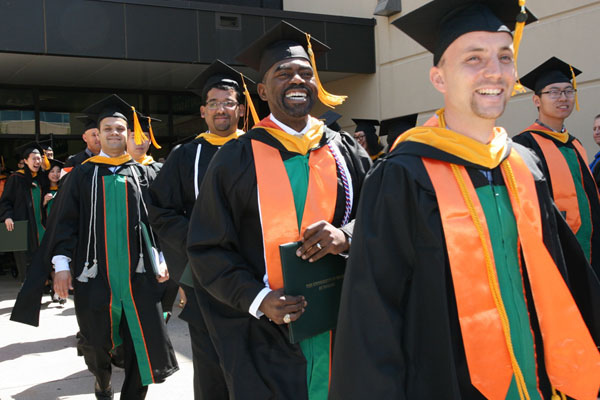 Master of science in management science graduates in cap and gown
