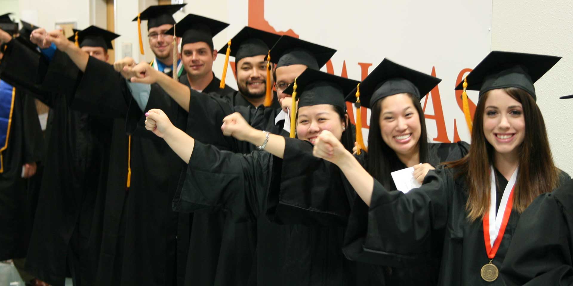 Jindal School students lined up on UT Dallas commencement day, getting ready to graduate with their degrees, including Master's in Management Science