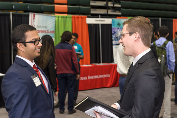 Supply Chain Management students networking at an industry event